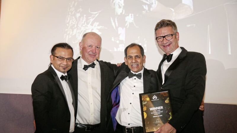 Irish Curry Awards founder Askir Ali, with head judges Paul O&#39;Connor and Joris Minne presenting Abdul Kabir of the Indian Ocean chain of restaurants a Lifetime achievement award. 