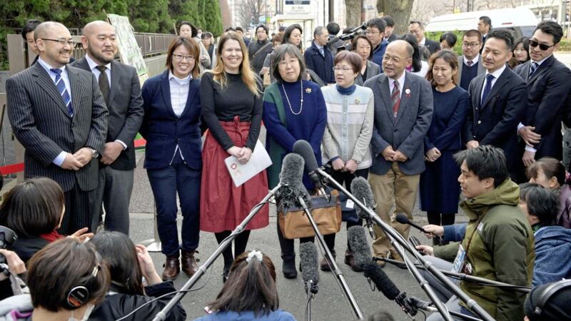 Plaintiffs speak to journalists before they file lawsuits challenging the constitutionality of the country&#39;s rejection of same-sex marriage, near Tokyo District Court in Tokyo Picture by Chika Ohshima/Kyodo News via AP 
