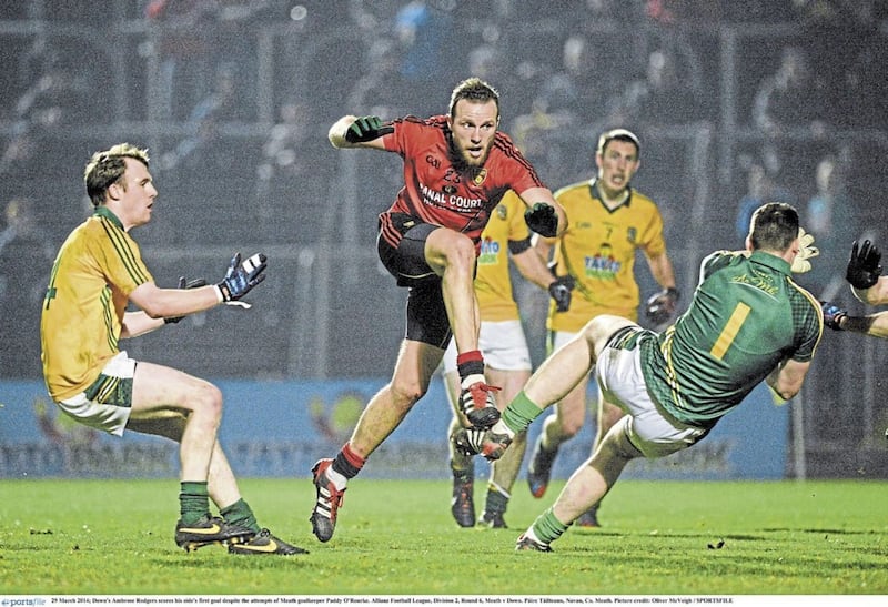 Ambrose Rodgers junior smashes the ball into the Meath net 