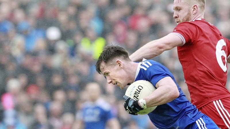 Karl O&#39;Connell of Monaghan tangles with Tyrone&#39;s Frank Burns during the Ulster Senior Football Championship quarter-final at Healy Park. Picture Margaret McLaughlin. 