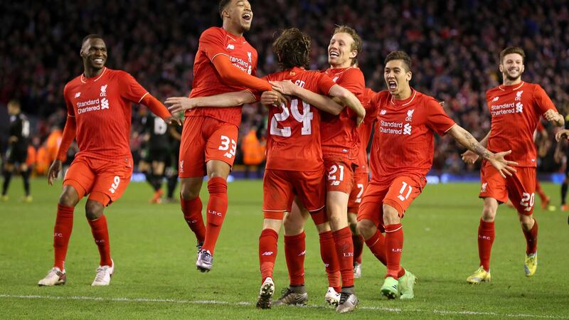 Liverpool's Joe Allen (centre) is mobbed by team-mates after scoring the winning goal in the penalty shootout against Stoke City