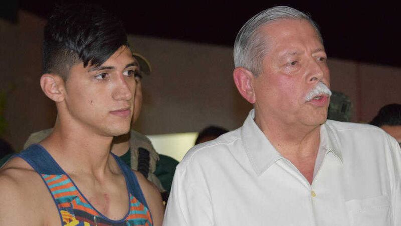Mexican soccer player Alan Pulido, left, stands next to Tamaulipas state governor Egidio Torre Cantu after Pulido was rescued from kidnappers in Ciudad Victoria, the capital of Tamaulipas State, Mexico. Picture by Alfredo Pena, Associated Press