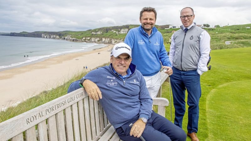 Paul McGinley, Chris Hollins and John Lawler, Royal Portrush Golf Club General manager, at the iconic fifth green overlooking the White Rocks beach, Portrush. Picture by Paul Faith 