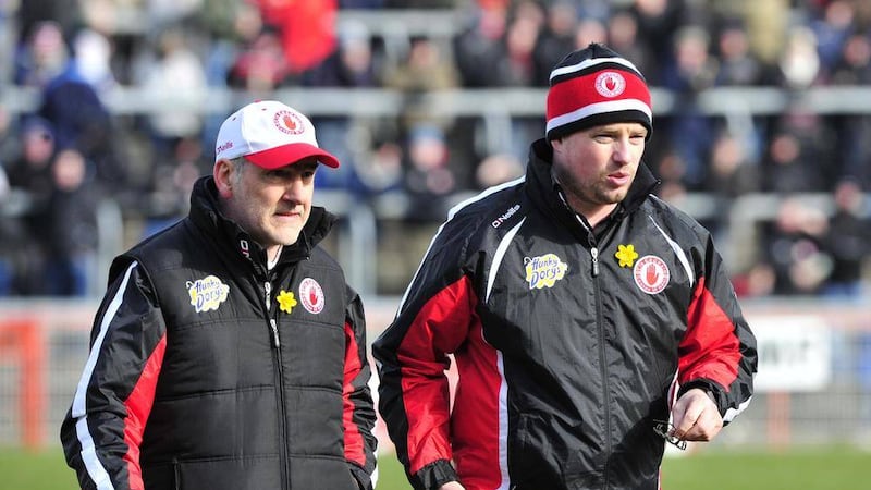Tyrone's Micky Harte and Gavin Devlin leave the field following Tyrone's loss to Cork in the National League&nbsp;