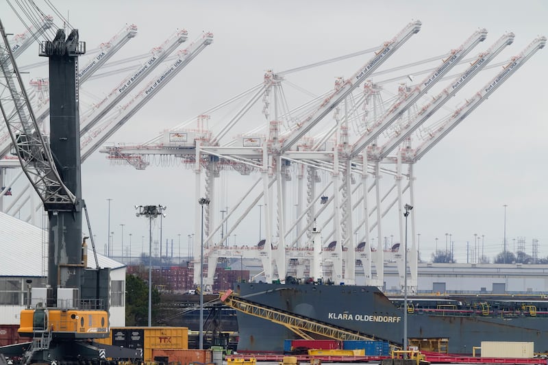 Cranes stand idle in Baltimore’s port (Matt Rourke/AP)