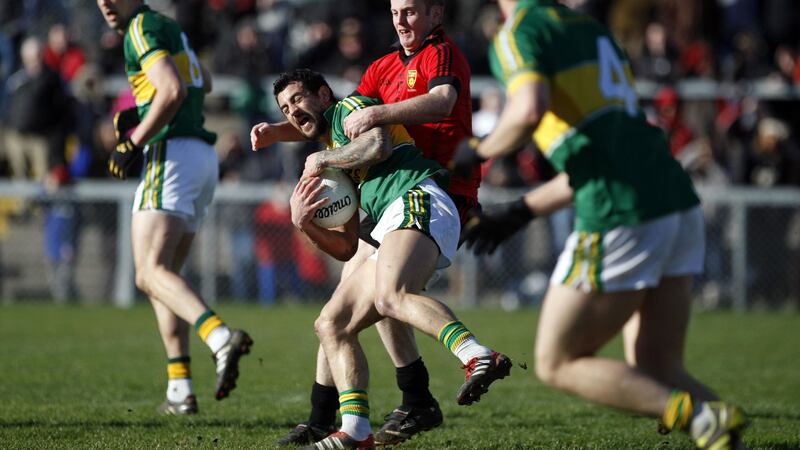 Kerry's Paul Galvin keeps possession despite strong pressure from Down's Benny Coulter during the National League, Division One game at Park Elser in Newry on April 12 2012