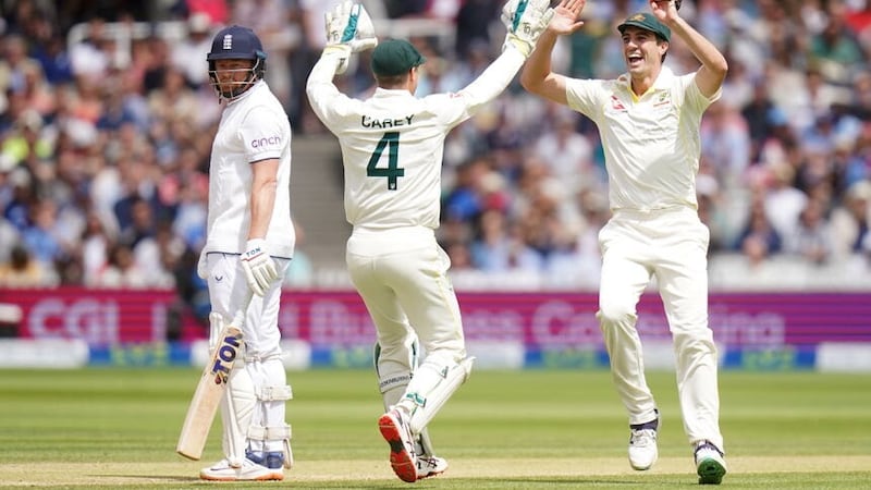 Australia’s Alex Carey (centre) celebrates the controversial run-out of England’s Jonny Bairstow (left) with Pat Cummins during day five of the second Ashes test match at Lord’s (Adam Davy/PA)