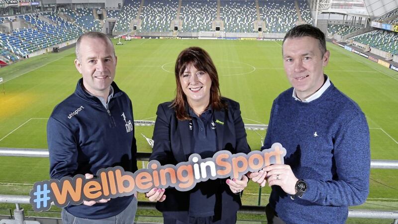 Oisin McConville (Sporting Chance facilitator and Sport NI mental helath ambassador) pictured with Steven Mills (club development officer with the Northern Ireland Football League) and Sport NI chief executive Antoinette McKeown. They were at Windsor Park to announce a new partnership between Sport NI, the NIFL and Sporting Chance 