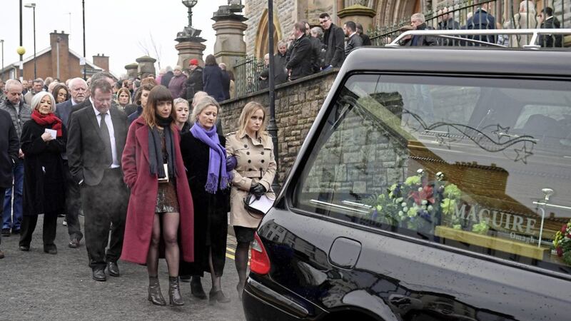 Arty McGlynn&#39;s wife Nollaig Casey and other family members follow his coffin from the church. Picture by Justin Kernoghan.  