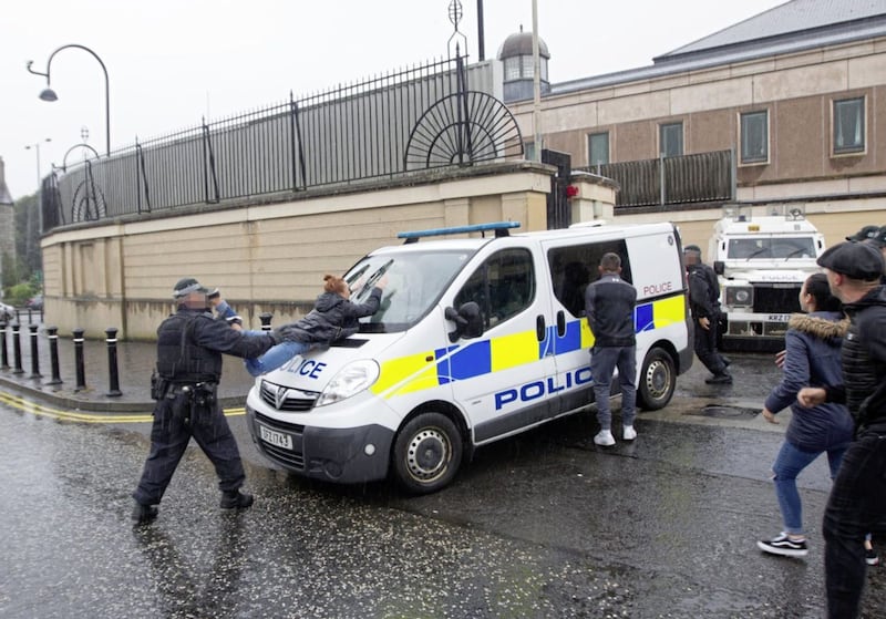 There were angry scenes outside the court as Amanda O&#39;Riordan, the mother of Brian Phelan&#39;s children, threw herself onto the police vehicle carrying Daniel Carroll. Picture by Newraypics.com 