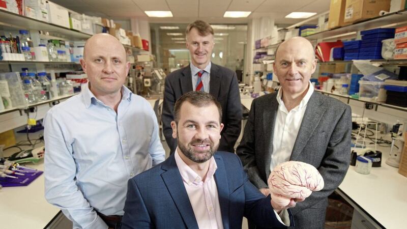 Dr Jason McKeown (seated) from Neurovalens with (from left) Jamie Andrews, Techstart Ventures; William McCulla, Invest NI and Ian Kerr, chair of Neurovalens 