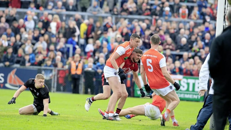 The Armagh defence in chaos as Connaire Harrison goes in after a long ball from Paul Devlin that ends up in the net. In total, 4-4 came off long balls on Sunday. Picture by Philip Walsh. 