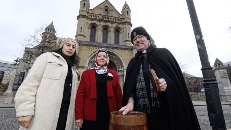 Dean Stephen Forde pictured outside St Anne&#39;s Cathedral with Nemat and Melika, refugees from Syria and Algeria who are supported by Footprints Women&#39;s Centre. Picture by Matt Mackey/Press Eye 