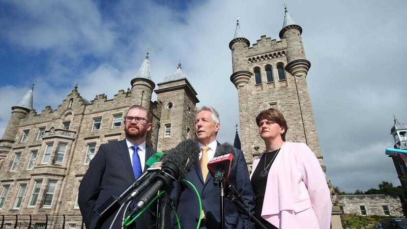.DUP leader Peter Robinson and party colleagues Arlene Foster and Simon hamilton pictured at a press conference at Stormont Castle on Friday. Picture Mal McCann. 
