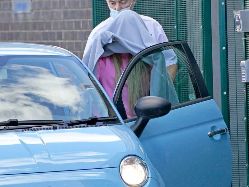 Katie Price, covered with a blanket, leaves Crawley Magistrates’ Court in September (Steve Parsons/PA)