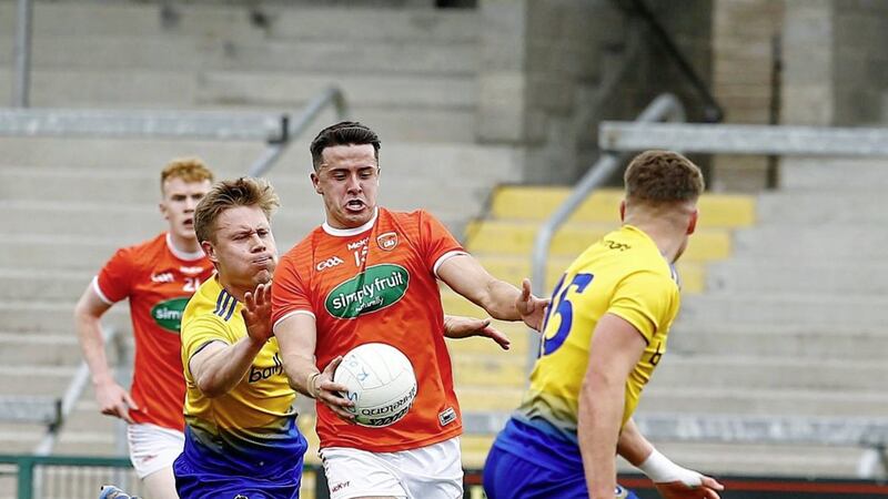 Armagh captain Stefan Campbell drives at the Roscommon defence during yesterday&#39;s relegation play-off at the Athletic Grounds. Picture by Philip Walsh 