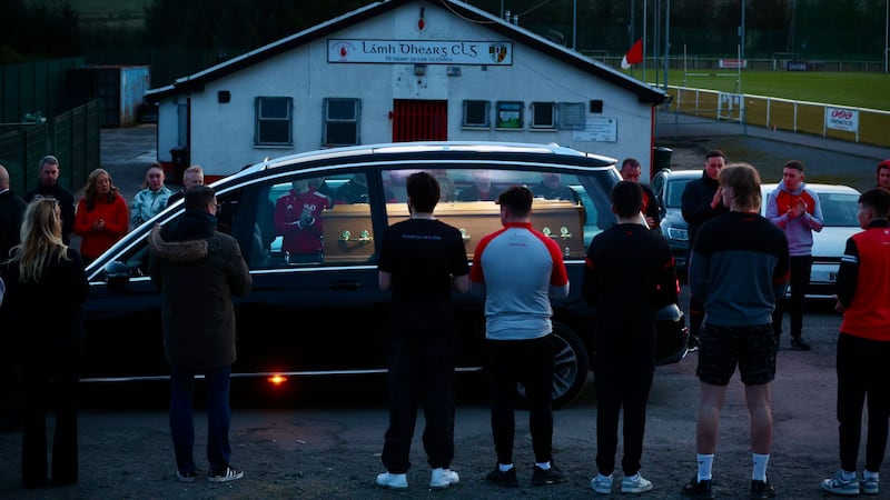 Ryan Straney's coffin is brought to Lámh Dhearg CLG on Thursday evening. PICTURE: MAL MCCANN