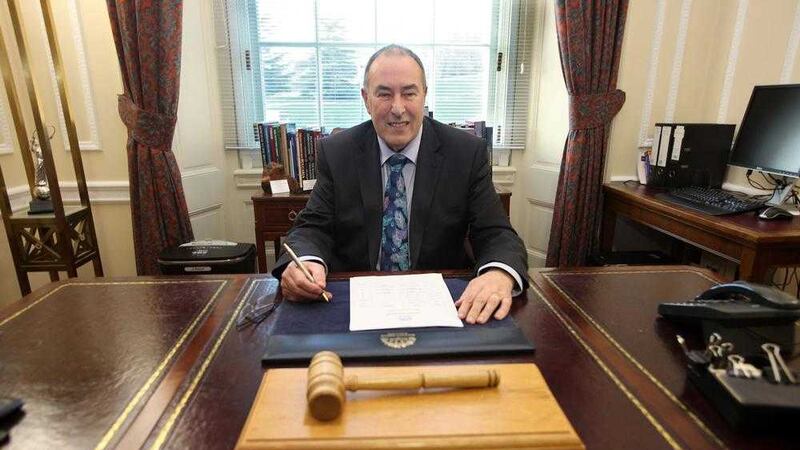 Mitchel McLaughlin taking his place at the assembly speaker's desk earlier this year