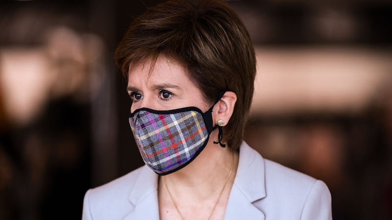 &nbsp;First Minister Nicola Sturgeon, wearing a Tartan face mask during a visit to New Look at Ford Kinaird Retail Park in Edinburgh. PA Photo.