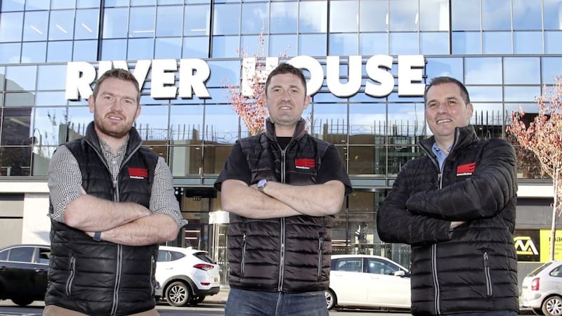 Premier Electrics&rsquo; Brendan McPeake (project manager), Martin O&rsquo;Rourke (site manager) and Liam Martin (operations manager) outside River House in Belfast, where the company is currently delivering a major electrical fit-out for mac-group. 
