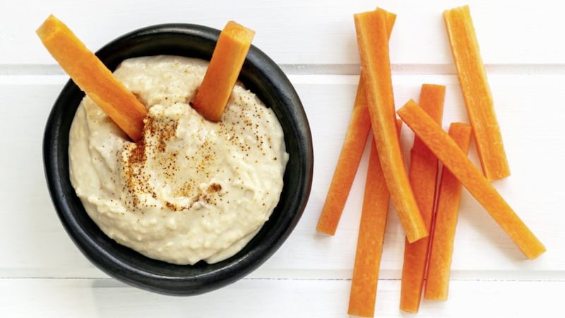 Houmous with carrot sticks are good choice for a healthy and surprisingly tasty snack 