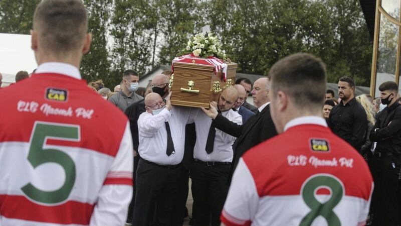 Anto Finnegan&#39;s coffin is brought into Christ the Redeemer church in west Belfast yesterday. Picture by Hugh Russell 