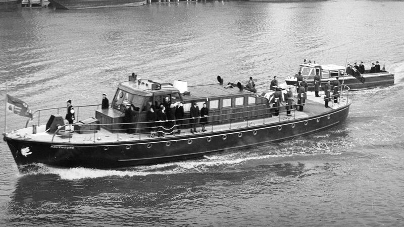 The Havengore, bearing the body of Sir Winston Churchill, travelling along the Thames to Festival Pier