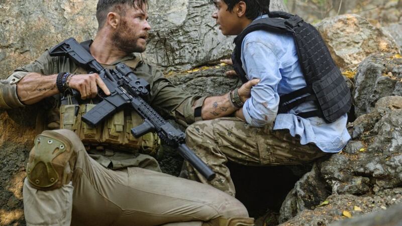 Chris Hemsworth and Rudhraksh Jaiswal in Extraction 