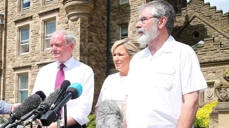 Sinn F&eacute;in President Gerry Adams along with Deputy First Minister Martin McGuinness and Health Minister Michelle O'Neill. Picture by Mal McCann