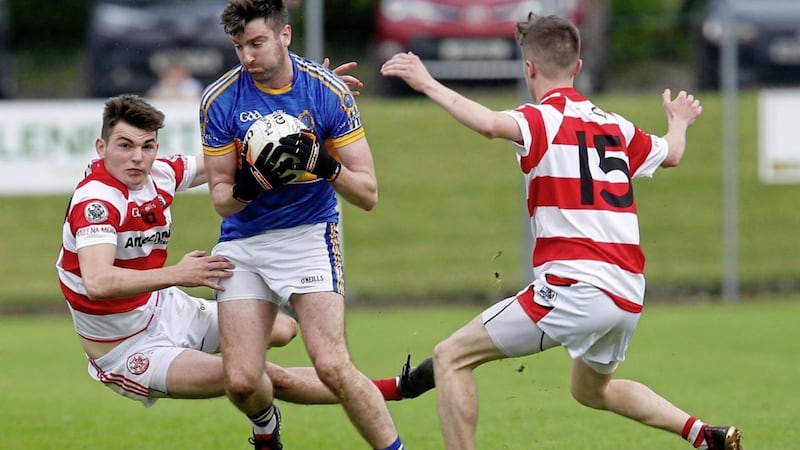 Tarlach Quinn (left) is one of a number of young Moortown players which give veteran forward Peter Devlin hope for the future of the newly crowned Tyrone intermediate champions 