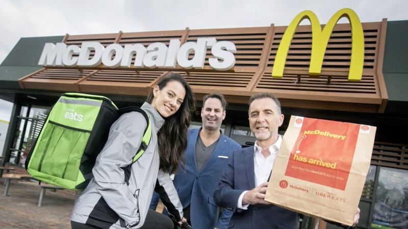 Pictured launching the new McDelivery service which will be available in four restaurants across Belfast are: Paul McDermott, McDonald&rsquo;s franchisee; Kieran Harte, managing director of Uber Ireland and Northern Ireland and Laura Smyth from UberEATS 