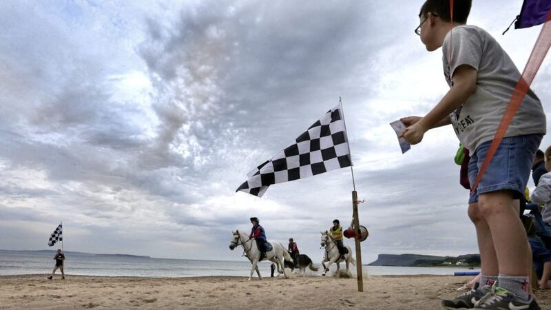 Horses race along the beach to the finish line on the first day of the Auld Lammas Fair in Ballycastle. Picture byMargaret McLaughlin 