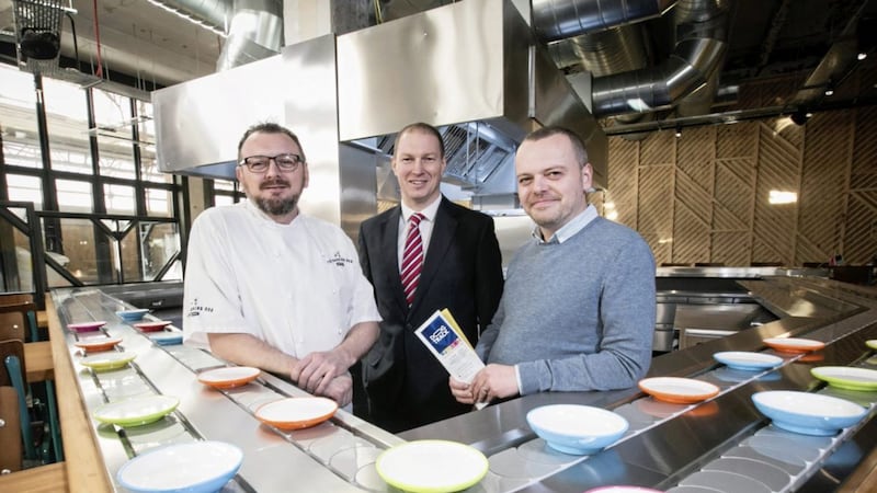 Owners of &#39;The Barking Dog&#39; on Malone Road, chef Michael O&#39;Connor and manager Michael Fletcher have opened a new restaurant called &#39;Dog Track&#39; at the newly refurbished Weaving Works. Pictured are Michael O&#39;Connor; Mark McKeown, business centre manager, First Trust Bank and Michael Fletcher.  