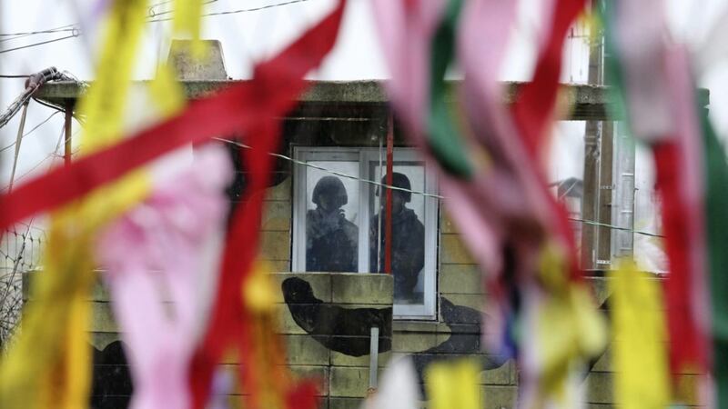 South Korean army soldiers stand guard inside a military guard post as ribbons hanging on a wire fence wishing for the reunification of the two Koreas at the Imjingak Pavilion in Paju near the border village of Panmunjom, South Korea Picture by Ahn Young-joon/AP 