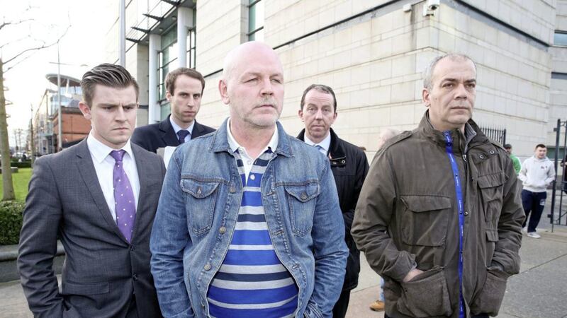 Alex McCrory (centre) and Colin Duffy (right) pictured following a court hearing in 2016. Picture by Mal McCann 