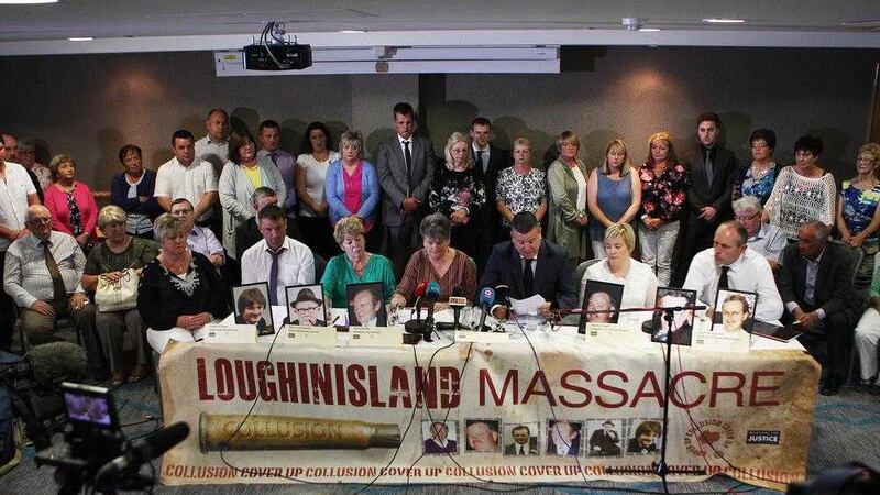 Relatives and victims of the Loughinisland Massacre look on as a statement is read out by Niall Murphy, their legal representative to the waiting media about the evidence of collusion between police and Loyalist Paramilitaries. Picture Matt Bohill. 