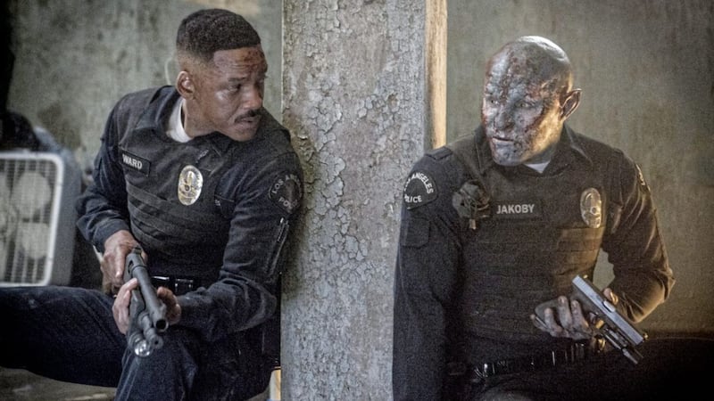 Mis-matched cops Ward (Will Smith) and Jakoby (Joel Edgerton) under fire in Bright 