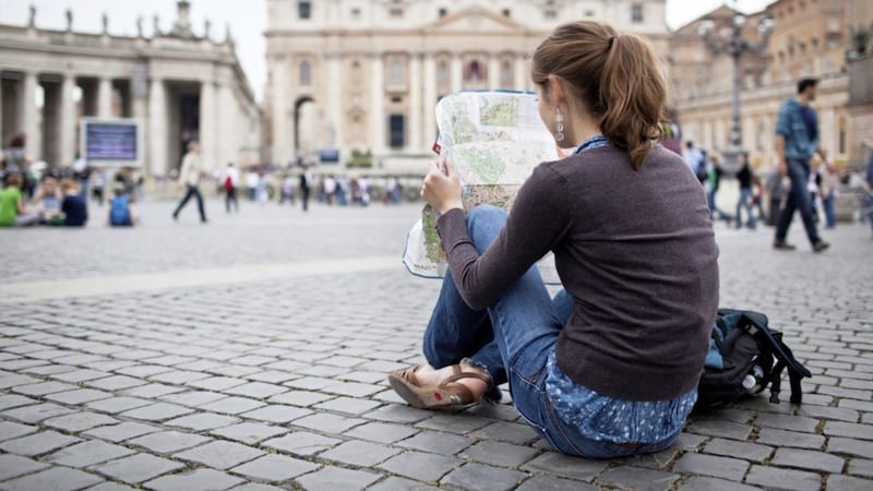 As this young tourist studies a map at St Peter&#39;s Square, could now be the time to consider a hotel tax in Northern Ireland? 