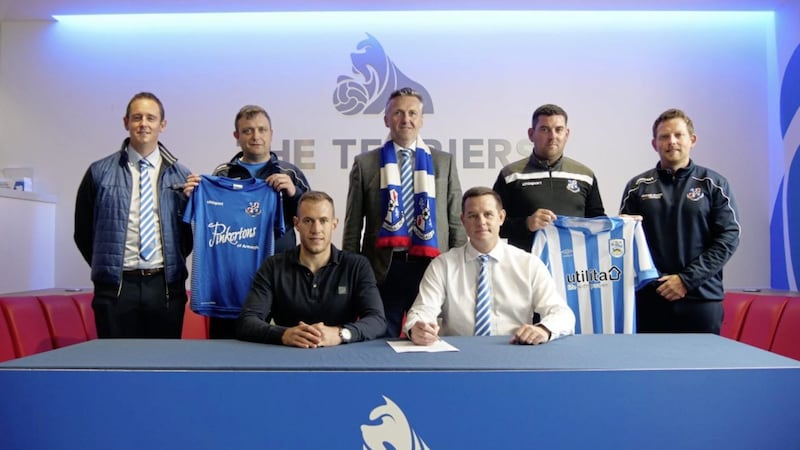 Pictured at yesterday&#39;s signing of the partnership between Loughgall and Huddersfield at the John Smith Stadium are (front row, l-r) Huddersfield academy manager Emyr Humphries and Loughgall youth development manager David Johnstone; (back row, l-r) Loughgall Youth chairman James Johnston, Loughgall Youth vice-chair Ernie Smyth, Loughgall chairman Sam Nicholson, Loughgall manager Dean Smith and Loughgall Youth committee member Denver Calvin 
