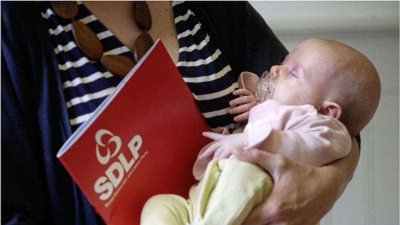 Baby Niamh Lyons snoozes at the SDLP manifesto launch. Picture by Hugh Russell 
