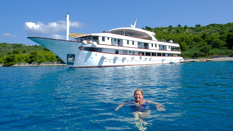 Hannah Stephenson swims off the small ship Bellissima (Hannah Stephenson/PA)