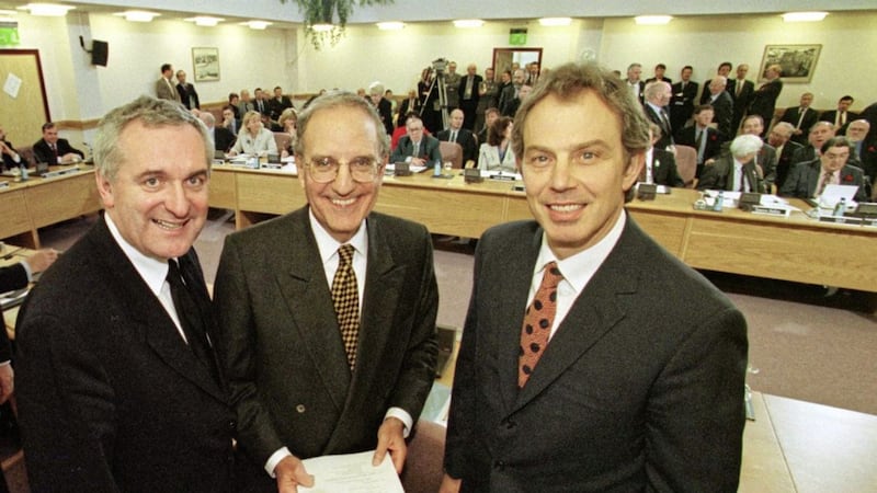 Former taoiseach Bertie Ahern, pictured with George Mitchell and Tony Blair at the signing of the Good Friday Agreement, has called for serious negotiations to take place over the Northern Ireland Protocol. Photo: PA Wire 