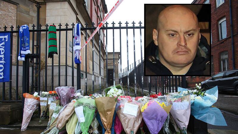 &nbsp;Floral tributes have been left at the scene where Ian Ogle was fatally stabbed in east Belfast. Picture by Mal McCann