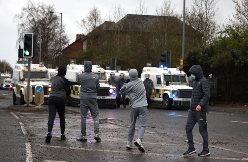 &nbsp;Youths throw stones towards PSNI officers on the Springfield road, during further unrest in Belfast. Picture date: Thursday April 8,