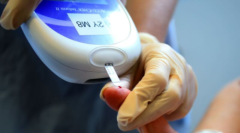 A patient takes a diabetes test (Peter Byrne/PA Images)