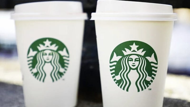 Starbucks has hailed &quot;good progress&quot; in plans to open 100 new stores in the UK over the current year 