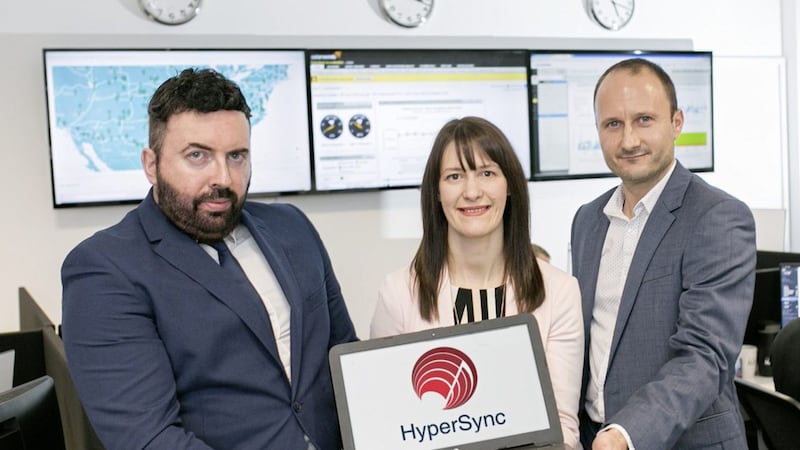 HyperSync chief executive officer, Marcus Thompson and chief technical officer, Neil Marrin pictured with Majella Barkley from the Innovation Factory at the company&#39;s new Belfast offices 