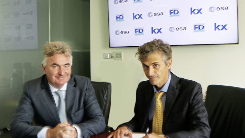 Kx technology CEO, Brian Conlon, and Elia Montanari from ESA Business Applications signing the agreement. 