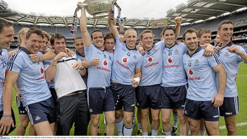 The Dublin team celebrate with the Delaney Cup after winning the 2011 Leinster SFC Final - they&#39;ve won every year since then too. 