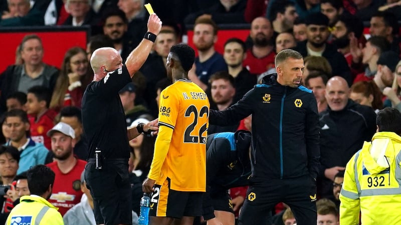 Referee Simon Hooper (left) did not award Wolves what looked a penalty during stoppage-time at Old Trafford (Nick Potts/PA)